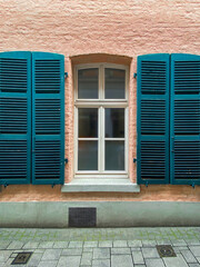 Window with wooden shutters. Germany.