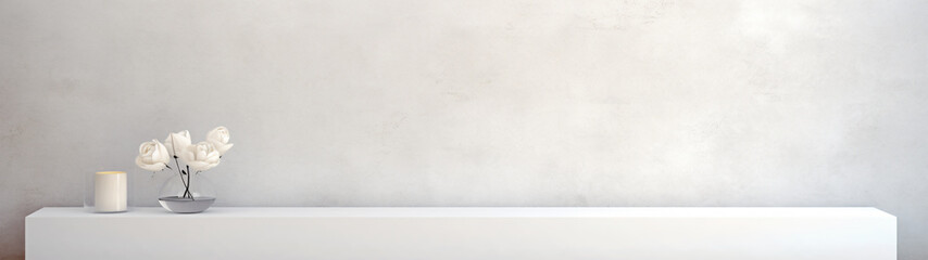 White flowers and candle on a white shelf against a white wall, minimalist design for product display. 
