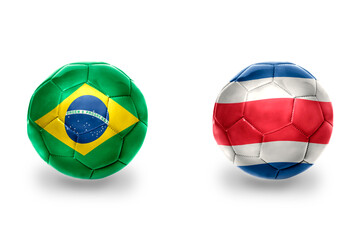 football balls with national flags of brazil and costa rica ,soccer teams. on the white background.