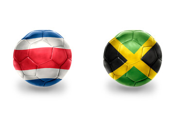 Fototapeta premium football balls with national flags of costa rica and jamaica ,soccer teams. on the white background.
