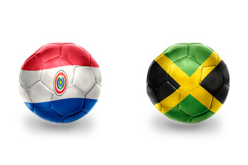 Fototapeta premium football balls with national flags of paraguay and jamaica ,soccer teams. on the white background.