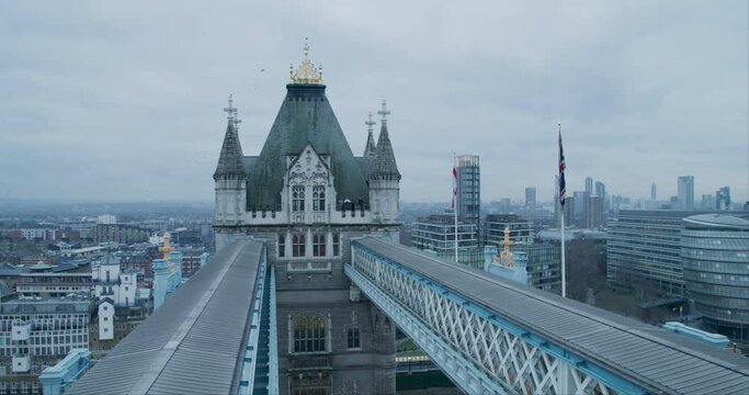 Tilt shot from busy street to top of tower bridge in London