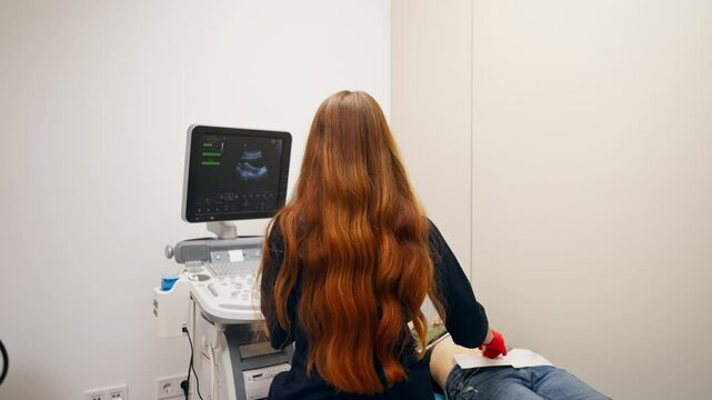 In a gynecological office in a clinic doctor conducts an ultrasound of a patient s small organs