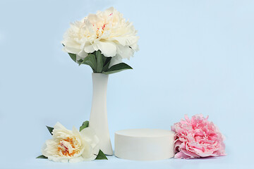 Abstract background with empty podium and peonies flowers, empty showcase for display or presentation of cosmetic products, Minimal floral arrangement card with place for text,