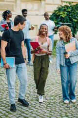 Fototapeta premium Full length shot of diverse students at campus walking towards camera.