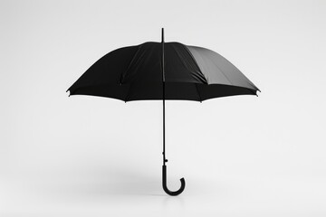A simple black and white umbrella sitting on a clean white background, great for use in product or design illustrations