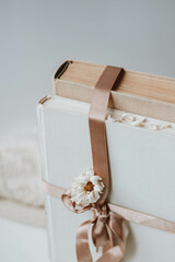 two vintage books with a beautiful satin ribbon and dried flowers