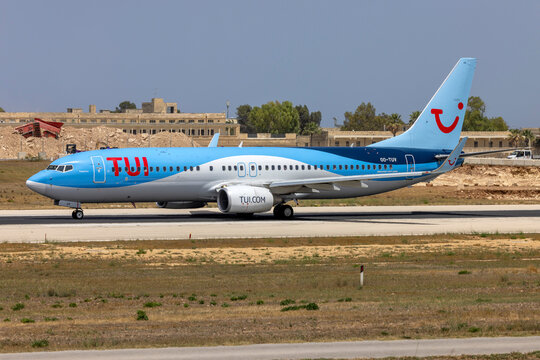 Luqa, Malta - June 10, 2024: TUI (TUI Airlines Belgium) Boeing 737-86J (Reg.: OO-TUV) backtracking runway 13 for take off in the midday heat.