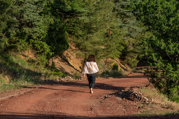 Woman hiking for health in the forest