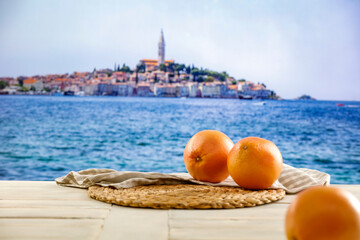 Grapefruit fruit and fresh citrus juice in glass on wooden table top with beautiful blur landscape...