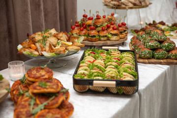 Catering buffet with variety of food snacks and appetizers.