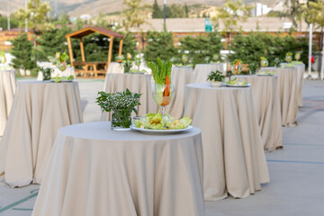 Wedding table setting in a restaurant. Wedding decor and food