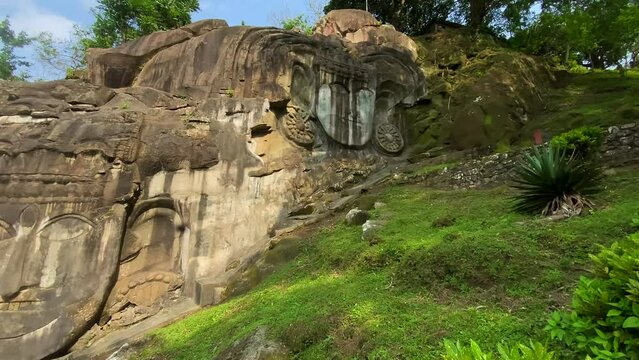 Unakoti a hindu archaeological site of bas relief structures from the ninth century. A must visit tourist destination in Tripura state of India.