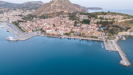 Obraz premium View from above on Nafplio city in Greece with port, Bourtzi fortress and blue Mediterranean sea soft focus