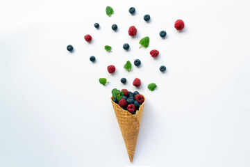 Forest fruit with ice cream cone on white background. Flat lay, copy space