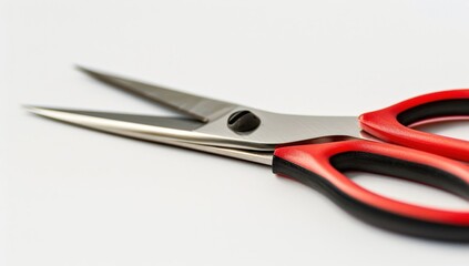 Scissors with Red Handles on a Plain Background