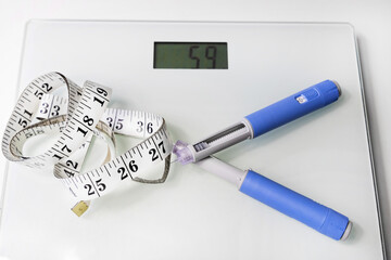  Ozempic Insulin injection pen for diabetics and weight loss. Concept of losing weight with the drug.