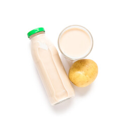 Bottle and glass of tasty potato milk on white background
