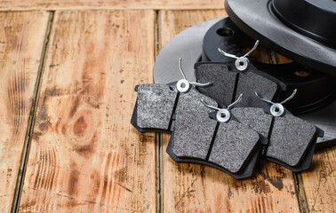 New spare parts for cars on a black background. Transport service concept. Vertical format,...