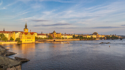 The old town of Prague above the Vltava river in a beautiful light at sunset, Czech Republic, Europe.