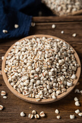 closed up of Job's tears on wooden table.