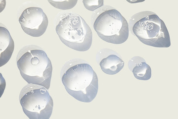 Cosmetic lotion or transparent gel drops texture background