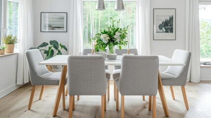 Elegant Dining Room Setup - White dining table with light wood legs, grey upholstered chairs, and a simple centerpiece of fresh flowers