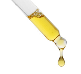 Fototapeta premium Dripping tincture from pipette isolated on white