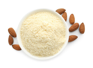 Fresh almond flour in bowl and nuts isolated on white, top view
