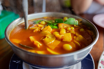 hot sour curry with pickled bamboo shoots and Ryukyu fish roe in metal pot, Asian food culture, Thai traditional food