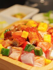 colorful salmon poke seafood rice bowl texture diced tamagoyaki okra cubes chopped eel unagi don bento lunch set top view