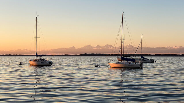 Sailboat on Lake Mendota with Golden Sky
