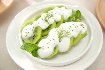 Kiwi with Yogurt on the Plate