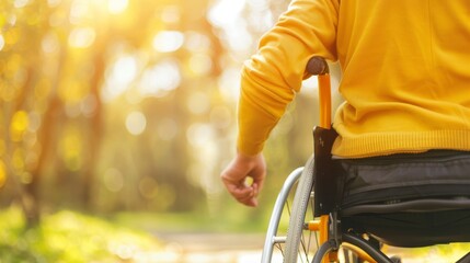 Obraz premium Empowering Diversity: Man with Physical Disability in Wheelchair in Urban Park - Inclusive Insurance & Accessibility Concept.