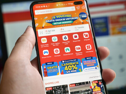 Tenggarong, November, 2023. browsing to shopee shop on phone, e-commerce social media commerce