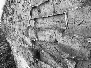 Close-up of a vintage brick wall with weathered bricks