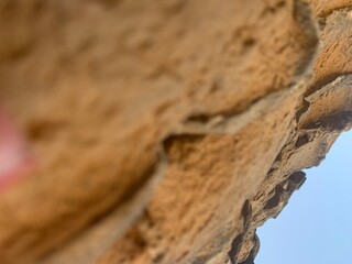 Close-up of a vintage brick wall with weathered bricks
