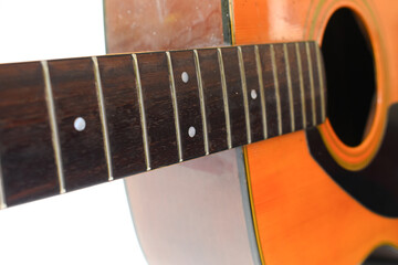 brown wood acoustic guitar isolated on white background