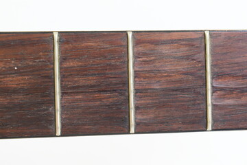 part of brown wood acoustic guitar isolated on white background