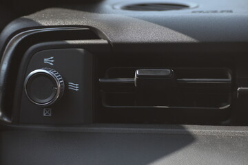 interior view of car with black leather, closeup car air conditional vents