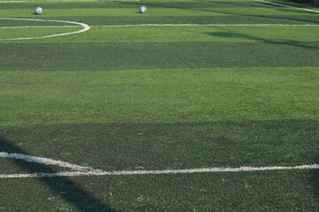 Fototapeta premium artificial green grass turf sport soccer field with black rubber granules infill