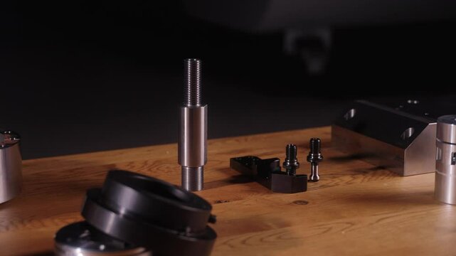 CNC'd metal pieces on a table p4