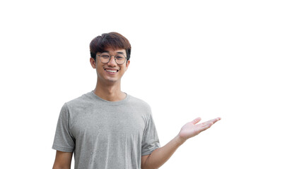 A young Asian man in his 20s wearing a gray t-shirt making a welcome gesture or presenting isolated...