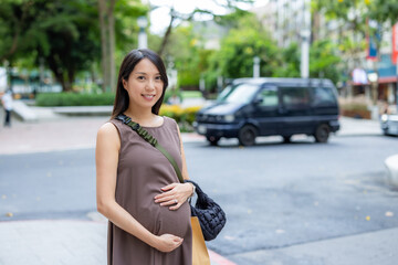 Pregnant woman walk in the Taipei city