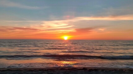 Fototapeta premium Tranquil Sunset Over Gentle Ocean Waves