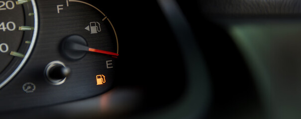 Empty fuel warning light in car dashboard. Fuel pump icon. gasoline gauge dash board in car with...
