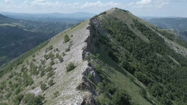 Soar above the majestic Italian mountains with this stunning drone footage. Enjoy breathtaking views of rugged peaks, lush valleys, and pristine natural beauty from a bird's-eye perspective. Nerone