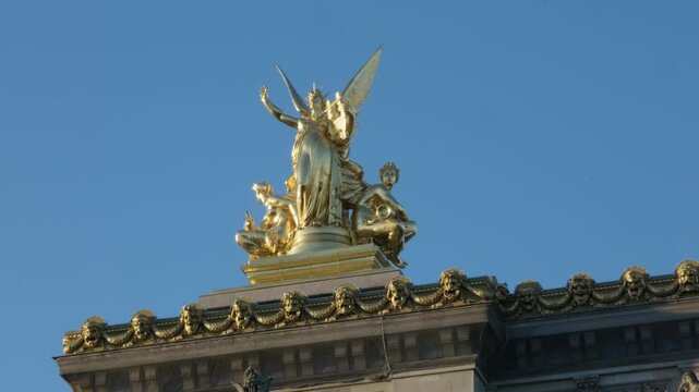 Shot of a beautiful gold statue decorating the opera garnier in Paris