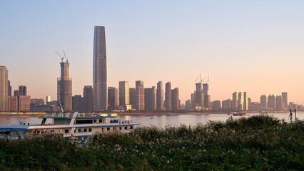Fototapeta premium city skyline of wuhan on the bank of yangtze river at sunset