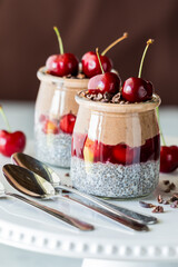 Delicious Black Forest chia puddings with chocolate mousse and fresh cherries.